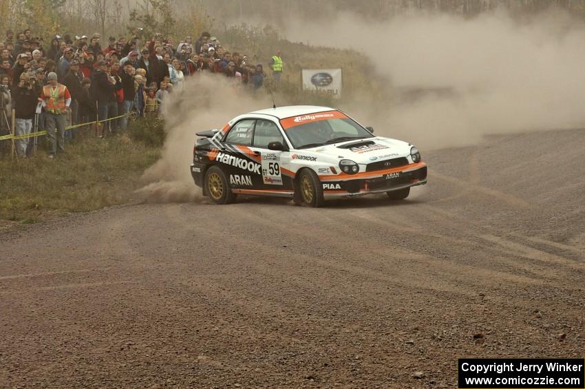 Pat Moro / Mike Rossey throw their Subaru WRX hard into a drift at the spectator point on SS1.