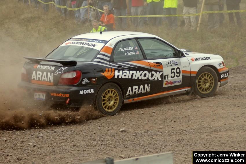 Pat Moro / Mike Rossey accelerate out of a left-hander at the spectator point on SS1 in their Subaru WRX.