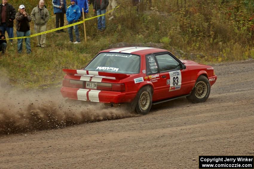 Mark Utecht / Rob Bohn power away from the spectator location on SS1 in their Ford Mustang.