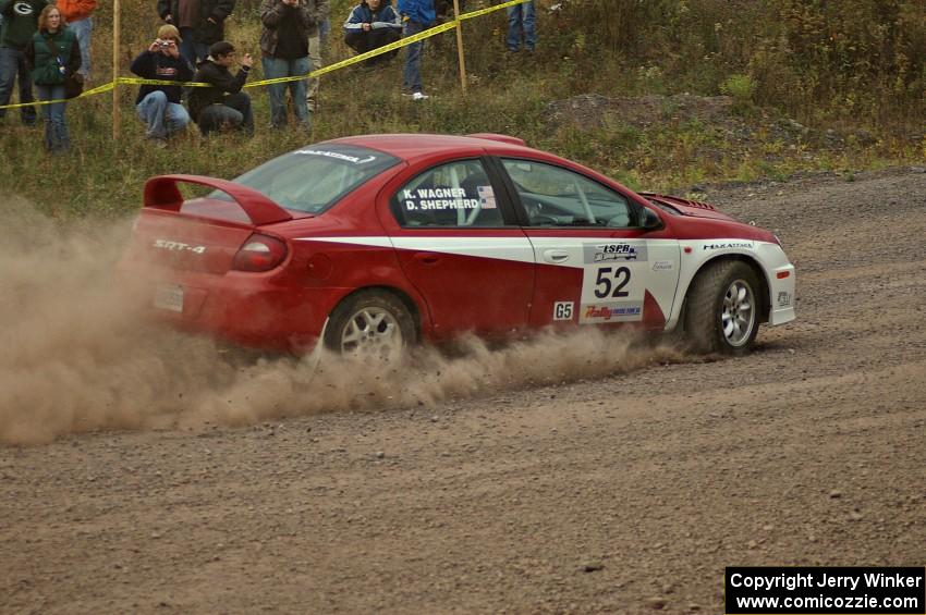 Doug Shepherd / Karen Wagner drift through a hard left on SS1 in their Dodge SRT-4.