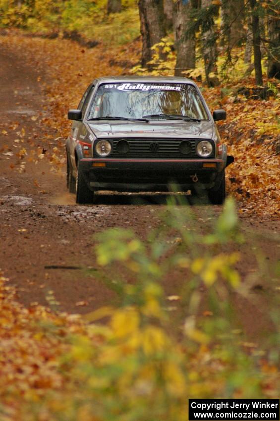 Dave Cizmas / Matt Himes down a fast slick straight on SS2, Beacon Hill, in their VW GTI.