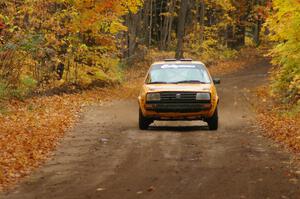The Chad Eixenberger / Jay Luikart VW Golf at speed down a straight on SS2, Beacon Hill.