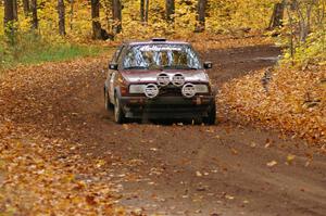 Billy Mann / Josh VanDenHeuvel accelerate out of a sweeper on SS2, Beacon Hill, in their VW GTI.