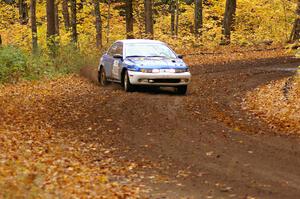 Mike Isaacs / Craig Walli drift their Saturn SL2 through a sweeper near the end of SS2, Beacon Hill.