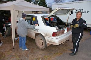 Tom Woodside makes sure things are good with the Dodge Shadow he and his son Greg Woodside share at the first Kenton service.