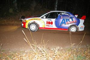 Arkadiusz Gruszka / Michal Chodan at speed near the finish of SS5 in their Mitsubishi Lancer Evo 9.