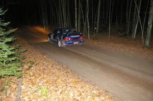 Kazimierz Pudelek / Lukasz Wronski at speed down a straight near the finish of SS5 in their Subaru Impreza.