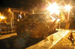 The Zach Babcock / Jeff Miller Dodge SRT-4 receives left-side repairs at the second Kenton service.