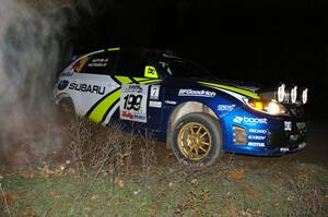 The Subaru WRX STi of Travis Pastrana / John Buffum apexes a 90-right on SS7.