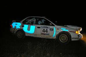 Henry Krolikowski / Cindy Krolikowski set up for a 90-right hand corner on SS7 in their Subaru Impreza.