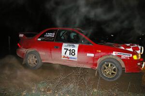 Dustin Kasten / Dave Parps at a 90-right at the spectator location on SS7 in their Subaru Impreza.