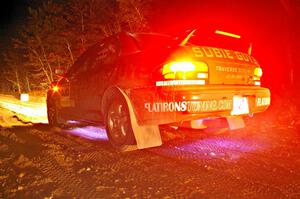 Matt Marker / Ben Slocum turn on the underside lights at the start of SS9, Menge Creek, in their Subaru Impreza.