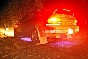Matt Marker / Ben Slocum turn on the underside lights at the start of SS9, Menge Creek, in their Subaru Impreza.