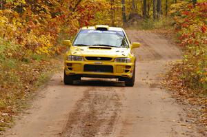 Kyle Sarasin / Mikael Johansson at speed down a straight in their Subaru Impreza near the finish of SS10, Gratiot Lake 1.