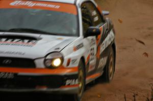 Pat Moro / Mike Rossey spray gravel at a sweeper in their Subaru WRX near the finish of SS10, Gratiot Lake 1.