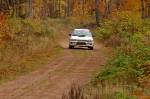 Henry Krolikowski / Cindy Krolikowski blast down a straight on Gratiot Lake 1, SS10, in their Subaru Impreza.