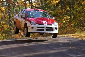 Doug Shepherd / Karen Wagner get nice air at the midpoint jump on Brockway 1, SS13, in their Dodge SRT-4.