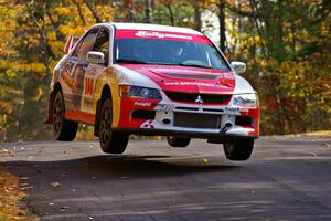 The Arkadiusz Gruszka / Michal Chodan Mitsubishi Lancer Evo 9 gets decent air at the midpoint jump of Brockway 1, SS13.