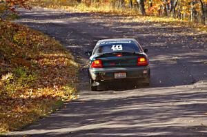 Chris Greenhouse / Don DeRose take it easy up the hill in their Neon just after the midpoint jump on Brockway 1, SS13.