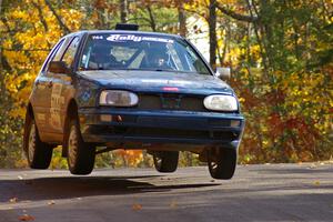 Paul Koll / Carl Seidel catch air at the midpoint jump on Brockway 1, SS13, in their VW Golf.