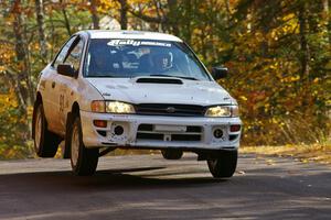 Bob Olson / Conrad Ketelsen get their Subaru 2.5 RS off the ground at the midpoint jump on SS13, Brockway 1.