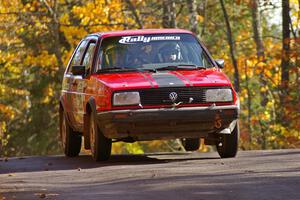 Mychal Summers / Ryan DesLaurier get the backend light at the midpoint jump on Brockway 1, SS13, in their VW Golf.