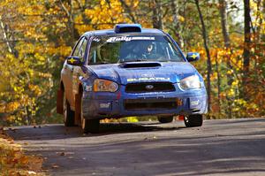 Slawomir Balda / Janusz Topor take it easy and catch no air over the midpoint jump on Brockway 1, SS13, in their Subaru WRX.