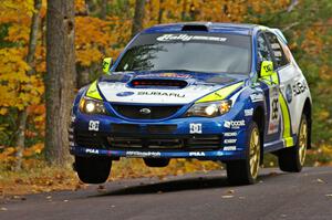 Travis Pastrana / John Buffum catch minimal air at the midpoint jump on SS14, Brockway 2, in their Subaru WRX STi.