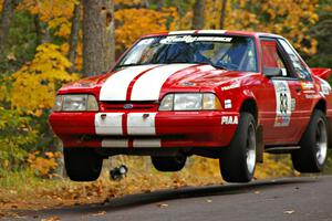 Mark Utecht / Rob Bohn catch decent air at the Brockway 2, SS14, midpoint jump in their Ford Mustang.