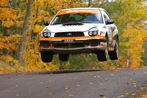 Pat Moro / Mike Rossey catch nice air in their Subaru WRX at the midpoint jump on Brockway 2, SS14.