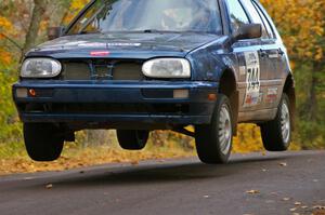 Paul Koll / Carl Seidel catch decent air at the midpoint jump on SS14, Brockway 2, in their VW Golf.