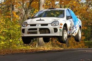 Zach Babcock / Jeff Miller get massive air at the midpoint jump of SS14, Brockway 2, in their Dodge SRT-4.