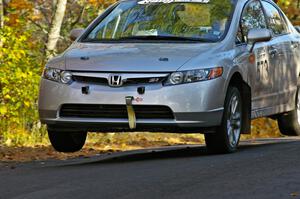 Justin Chiodo / Mike Neisen catch a little air on the Brockway 2, SS14, midpoint jump in their Honda Civic.