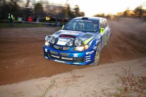 Travis Pastrana / John Buffum drift beautifully past spectators near the finish of SS17, Gratiot Lake 2, in their Subaru WRX STi