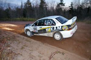 Andi Mancin / Maciej Wislawski drift through a sweeper in their Mitsubishi Evo 9 on Gratiot Lake 2, SS17.