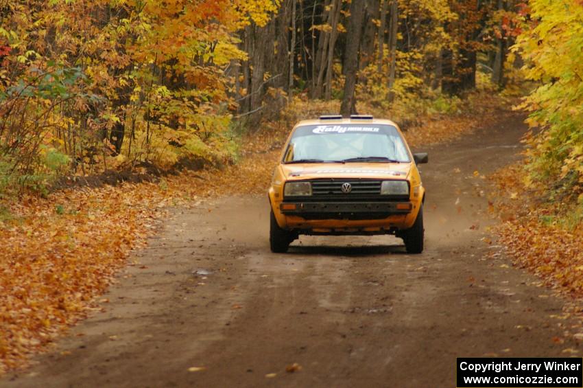 The Chad Eixenberger / Jay Luikart VW Golf at speed down a straight on SS2, Beacon Hill.