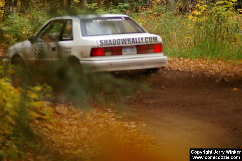 Greg Woodside / Tom Woodside drift their Dodge Shadow through one of the final corners of SS2, Beacon Hill.