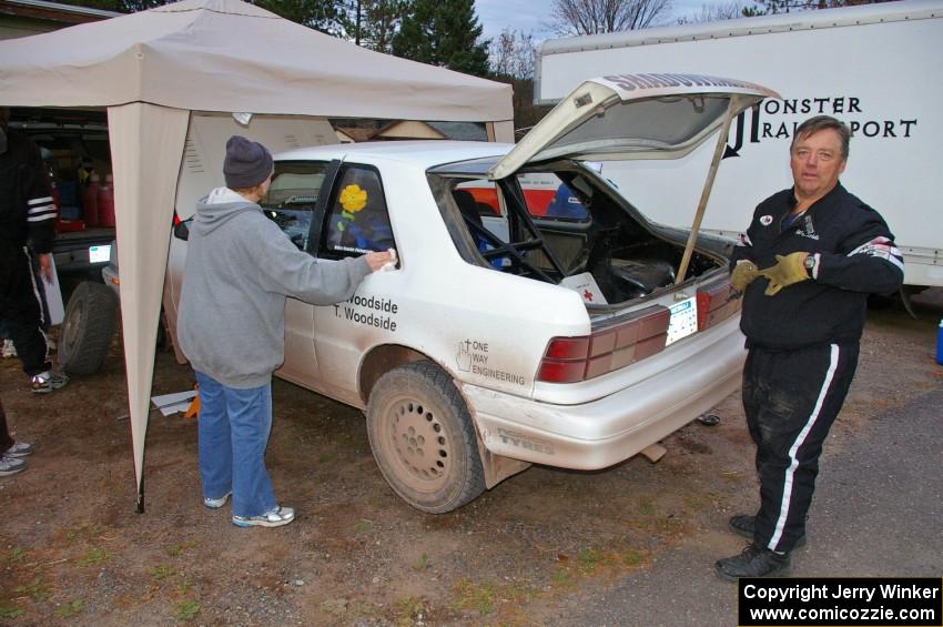 Tom Woodside makes sure things are good with the Dodge Shadow he and his son Greg Woodside share at the first Kenton service.