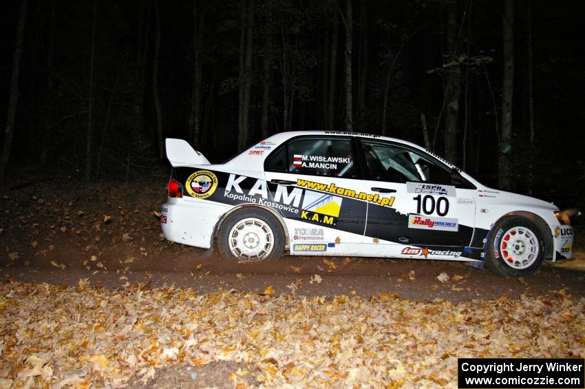 Andi Mancin / Maciej Wislawski fly into the finish of SS5 in their Mitsubishi Evo 9.