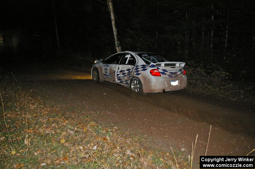 Zach Babcock / Jeff Miller sport fresh damage on their Dodge SRT-4 on SS5.