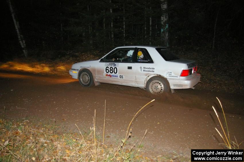 Greg Woodside / Tom Woodside fly into the finish of SS5 in their Dodge Shadow.