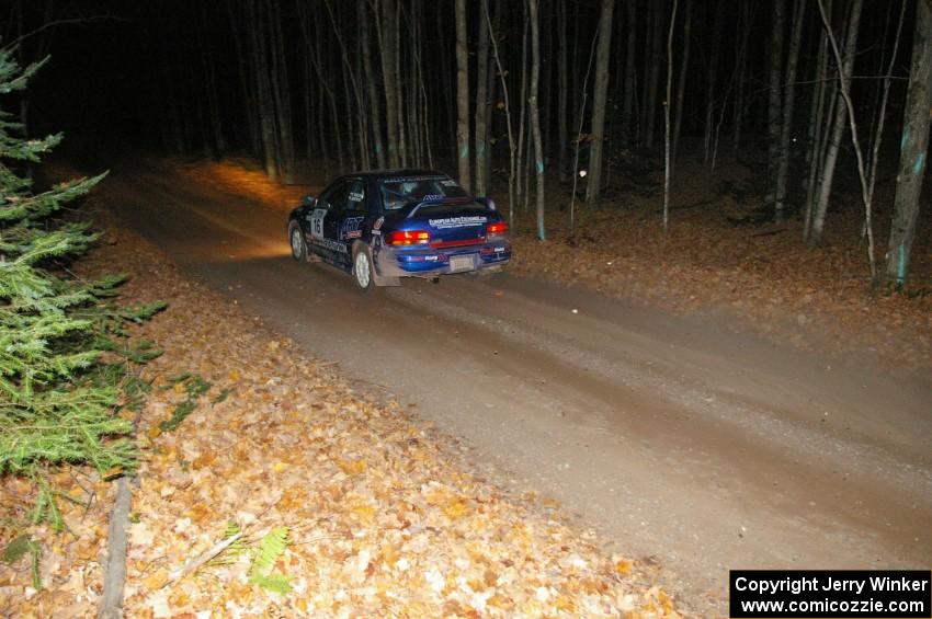 Kazimierz Pudelek / Lukasz Wronski at speed down a straight near the finish of SS5 in their Subaru Impreza.