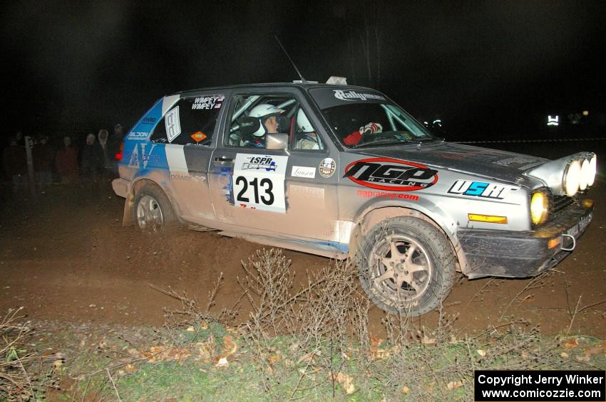 Josh Wimpey / Jeremy Wimpey apex a 90-right in their VW GTI on SS7.