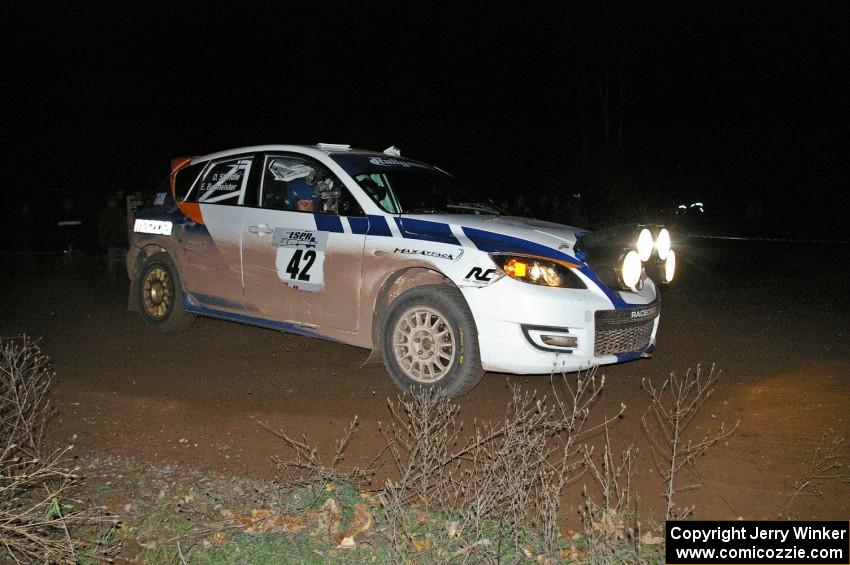 Eric Burmeister / Dave Shindle drift their Mazda Speed 3 through a 90-right on SS7.