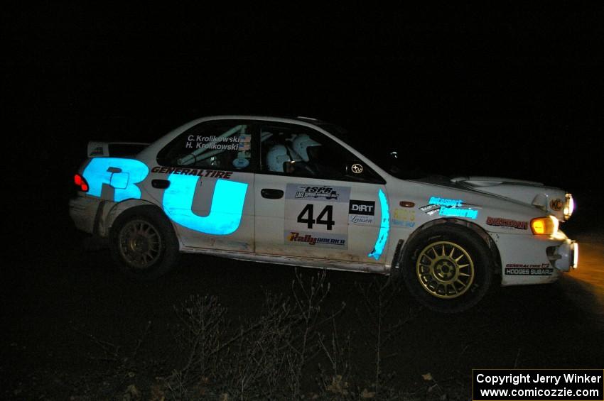 Henry Krolikowski / Cindy Krolikowski set up for a 90-right hand corner on SS7 in their Subaru Impreza.