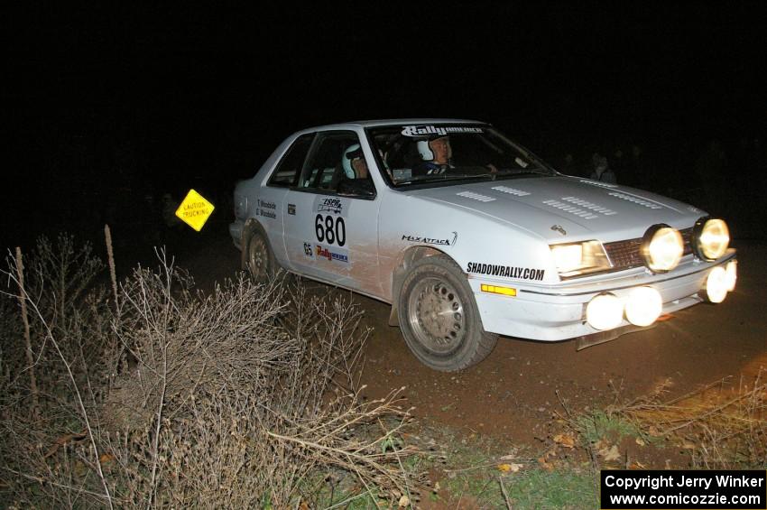 Greg Woodside / Tom Woodside fling their Dodge Shadow through a 90-right at the spectator location on SS7.