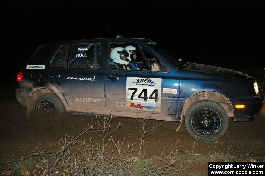 Paul Koll / Carl Seidel drift their VW Golf past the 90-right spectator point on SS7.