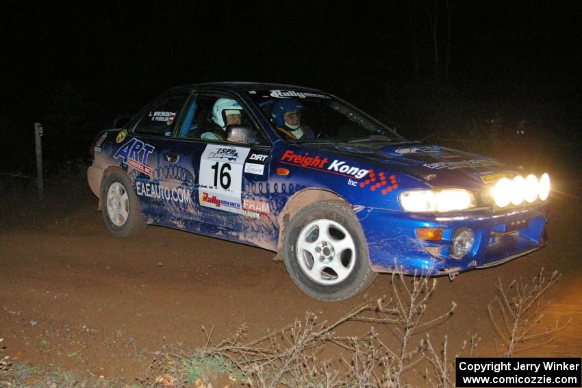 Kazimierz Pudelek / Lukasz Wronski drift their Subaru Impreza through the 90-right spectator location on SS7.