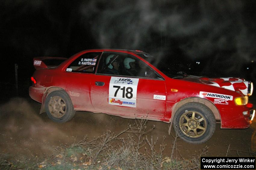 Dustin Kasten / Dave Parps at a 90-right at the spectator location on SS7 in their Subaru Impreza.