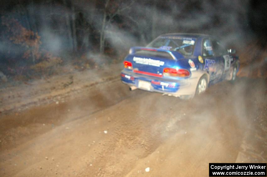 Kazimierz Pudelek / Lukasz Wronski accelerate their Subaru Impreza from the start of SS9, Menge Creek.